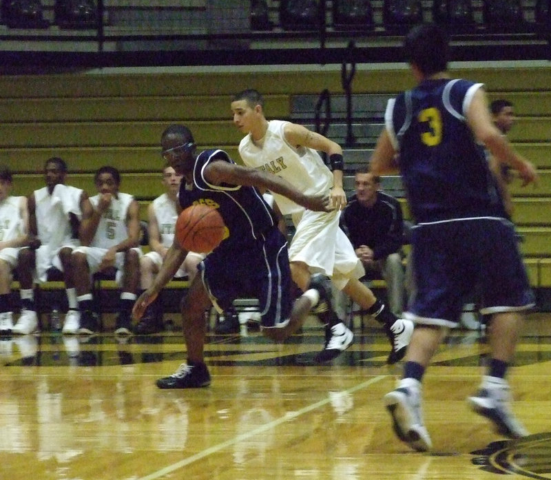 Image: Loose Ball — Oscar Gonzalez chases an Eagle ball handler.