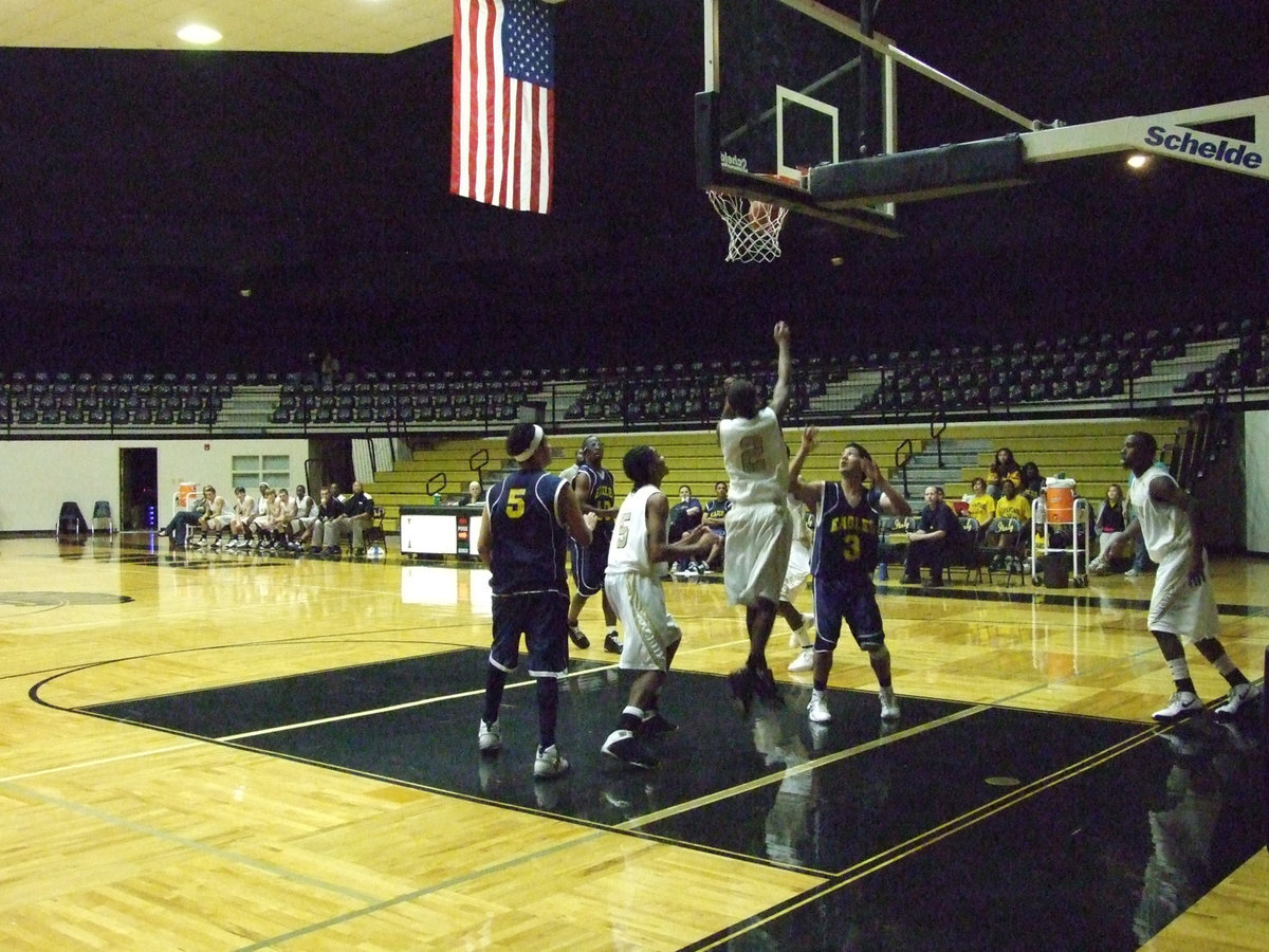 Image: Clemons Defends — Italy’s #2 Heath Clemons tries to shew away an Eagle player from the lane.