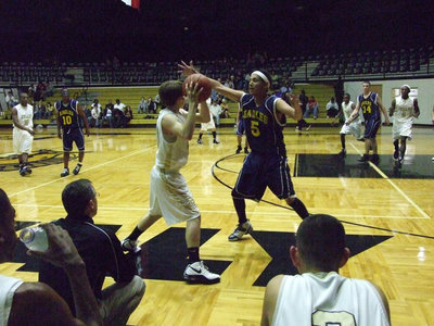 Image: Dan The Man — Dan Crownover tries to pass around the wide wingspan of an Eagle defender.