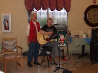 Image: Fun at Trinity Mission — Vivian Brooks and Bobbie singing Christmas songs.