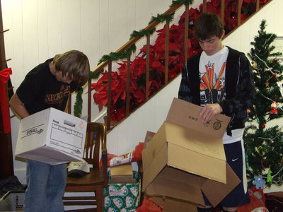 Image: DeMoss and Latimer — Even the youth pitched in.  Italy High School students, Alex DeMoss and Zach Latimer, broke down boxes, did some heavy lifting and helped wherever needed on Saturday.