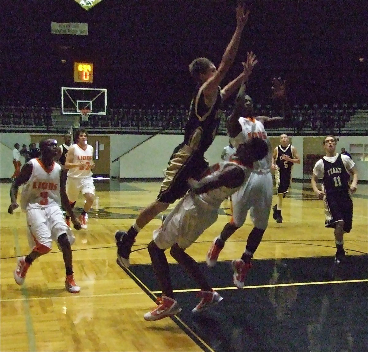 Image: Jase charges — The high-flying Jase Holden(4) gets called for charging on this play to the dismay of Italy JV Head Coach Larry Mayberry.