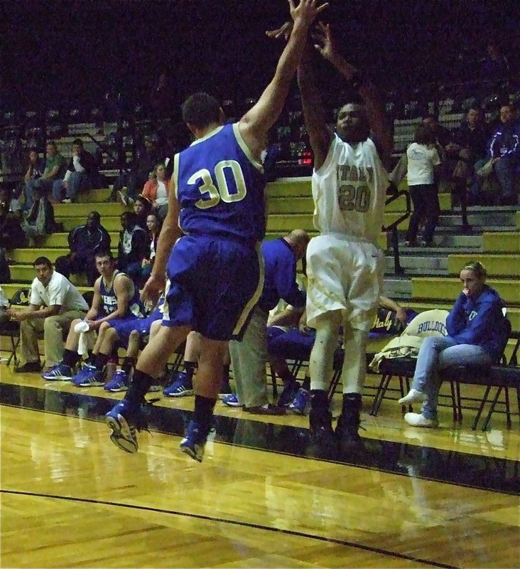 Image: Sephus for three — De’Andre Sephus knocks down a 3-pointer over the Venus Bulldogs.