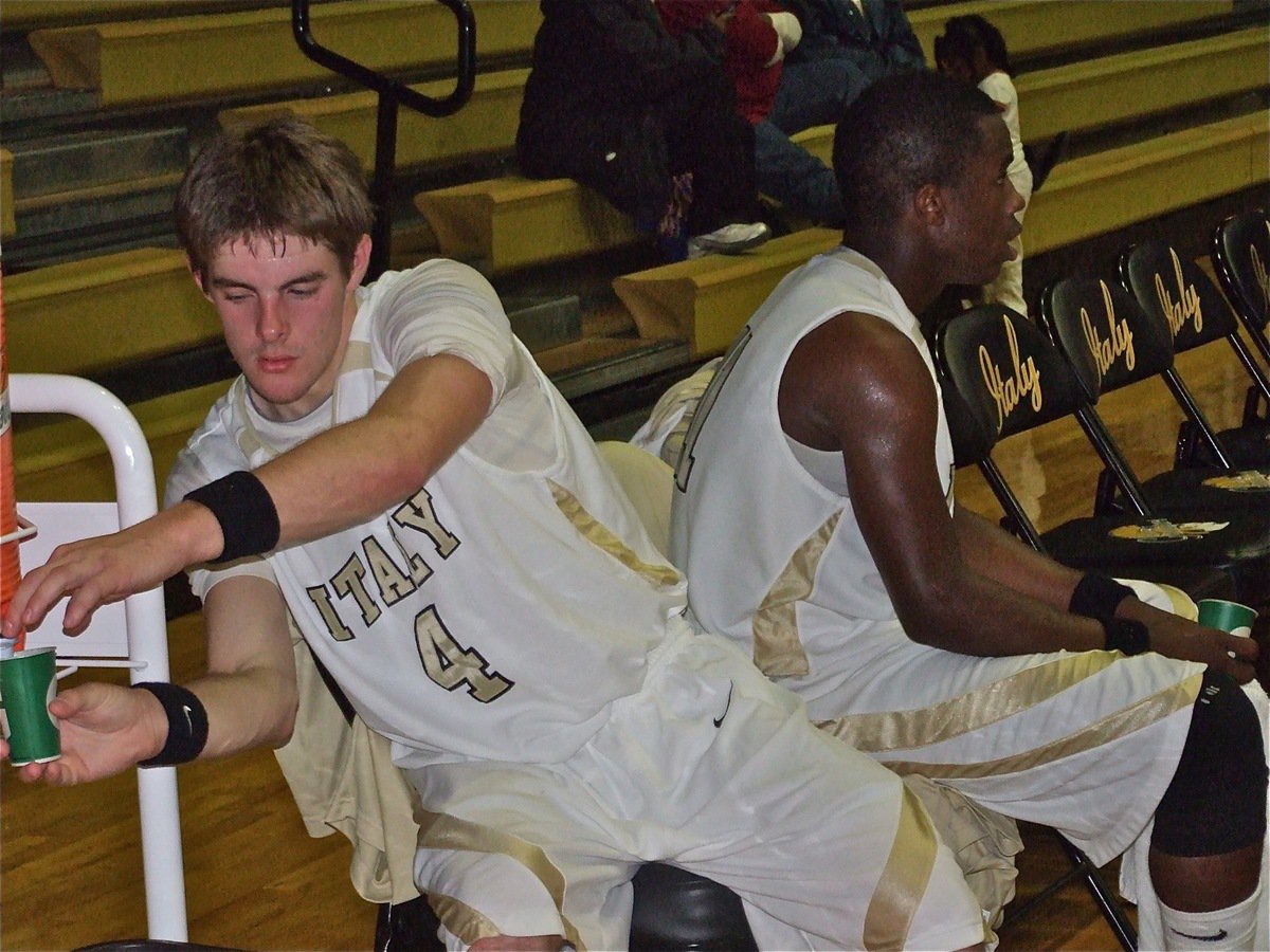 Image: Ryan and Jasenio — Gladiators Ryan Ashcraft(4) and Jasenio Anderson(11) take a water break.