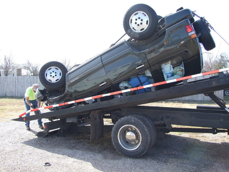 Image: Unfortunate Accident — Caitlin McCown’s Isuzu Trooper was towed in upside down by Helm’s Garage after an accident on Chambers Creek Bridge Friday about 10:45 a.m.