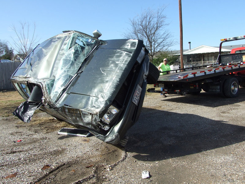 Image: Back On All Fours — Mr. Helms sets the vehicle upright noticing that all four tires never went flat.