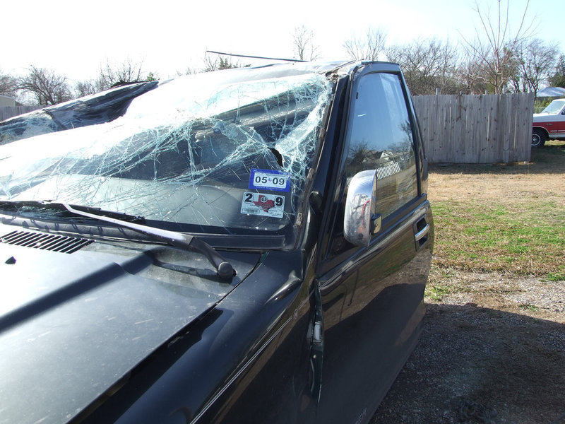 Image: Drivers Side Damage — The roof caved in after Caitlin McCown’s Isuzu flipped upside down on Chambers Creek Bridge.