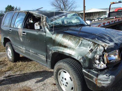 Image: Better Days — The “Super-Duper Trooper” may have seen better days, but the driver, Caitlin McCown, will miss her beloved SUV.