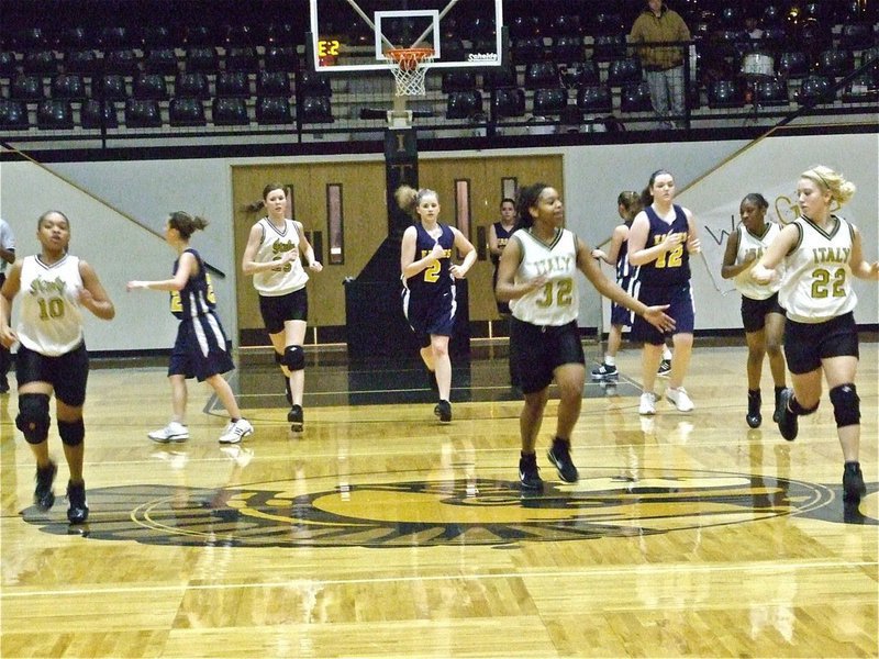 Image: Lucky uniforms — Wearing the throwbacks, the current Italy Lady Gladiators get the job done against the Waxahachie Advantage Lady Eagles.