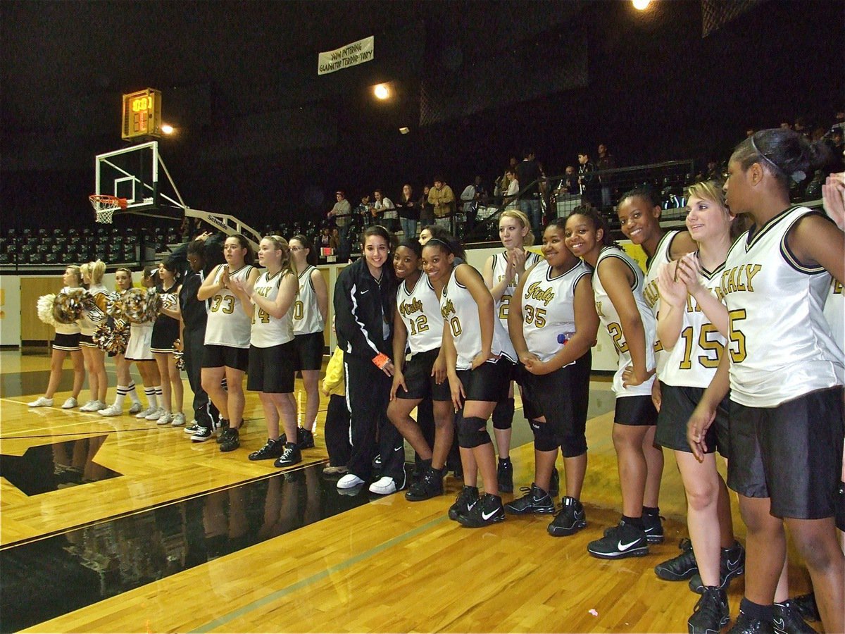 Image: Show of thanks — The Lady Gladiators and Italy High School cheerleaders formed a line to congratulate their honored alumni on a job well done.