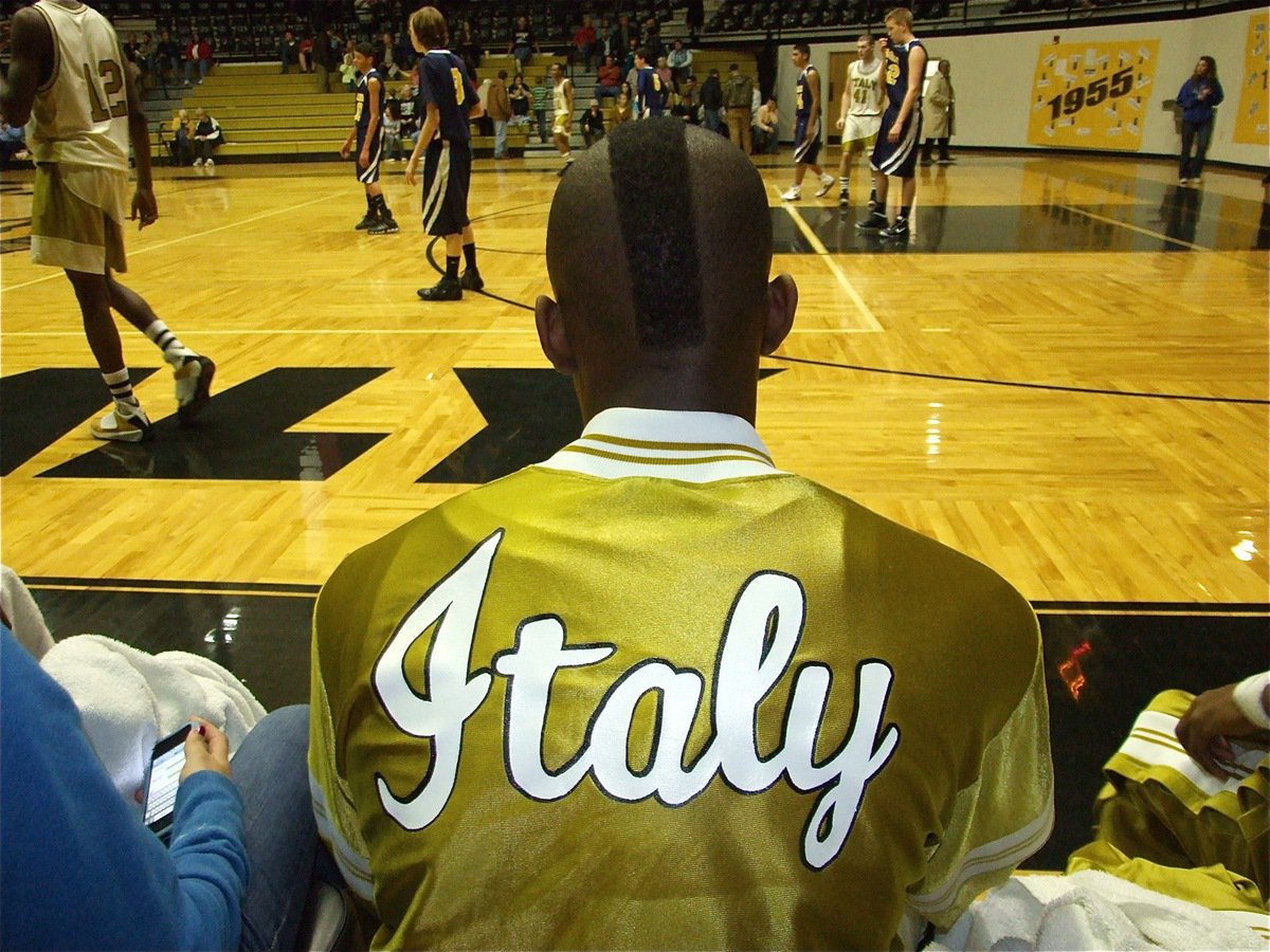 Image: Old school, new look — Thanks to senior Desmond Anderson, it is safe to say this is the first time this old uniform was ever worn by a player with a mohawk cut.