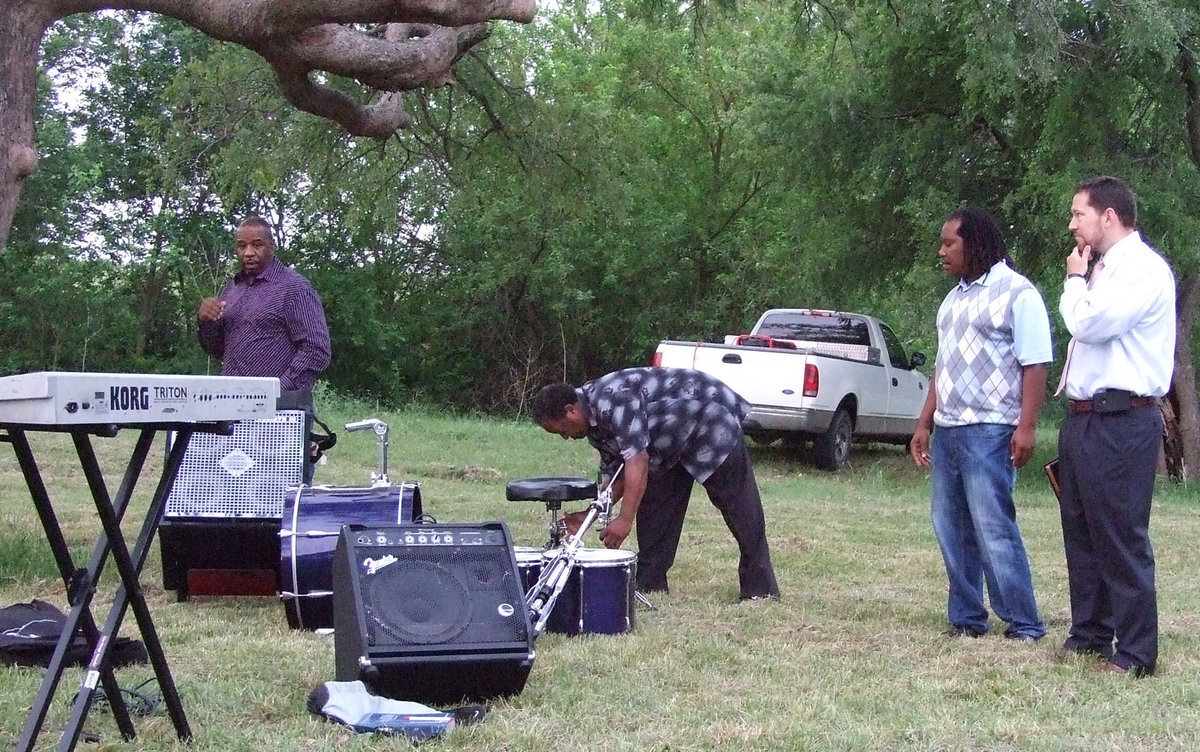 Image: Get the band together — The band put things together for the service.