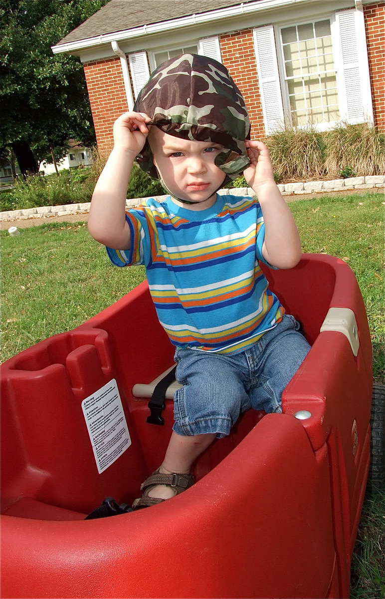 Image: Trevor’s versatile — After the Easter Egg hunt, Trevor Connor uses his easter basket as a hat.