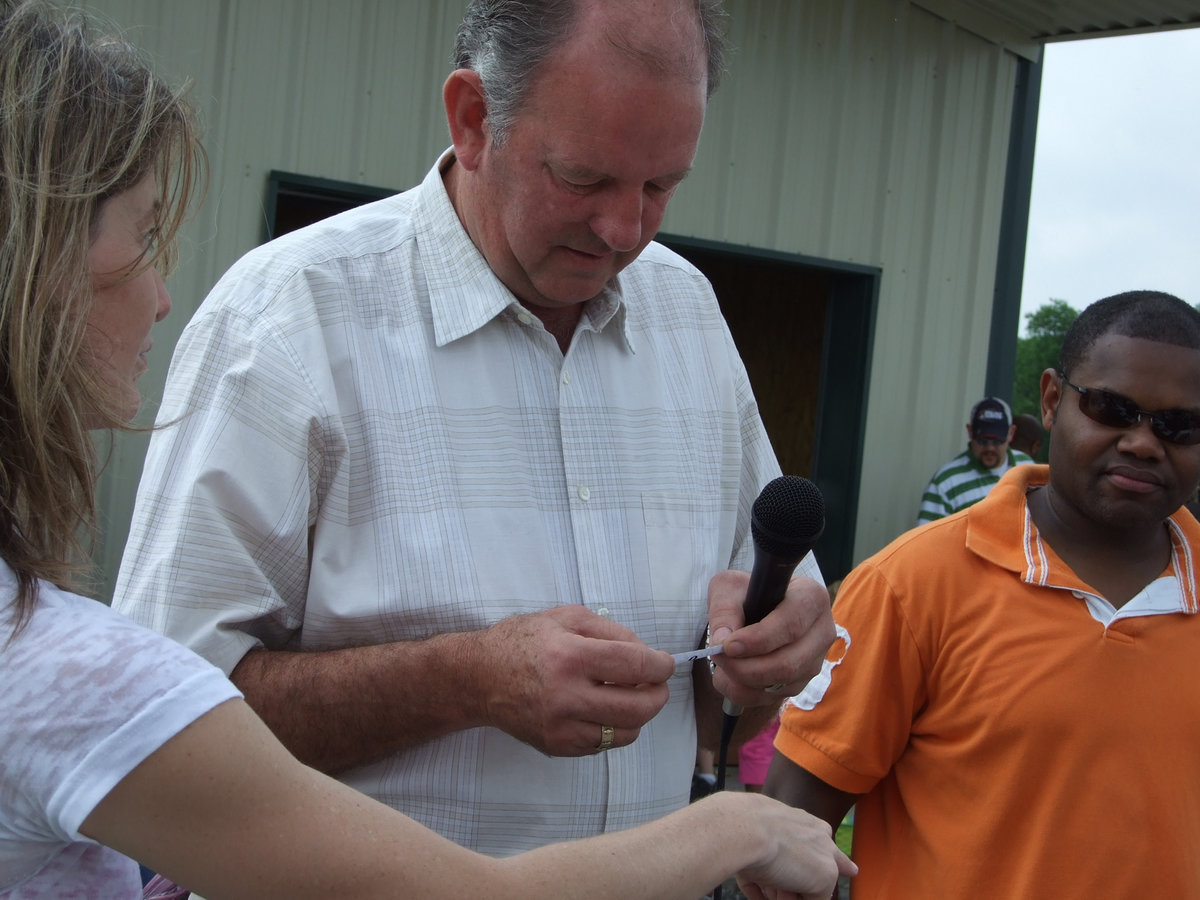 Image: Hobbs and Company — Ronda Cockerham, James Hobbs and Bryant Cochran announce winners of the prize eggs.