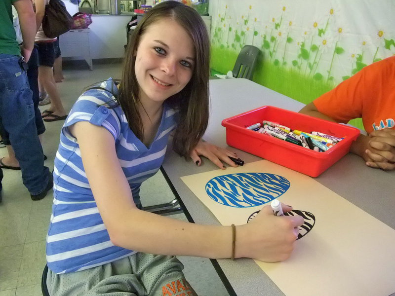 Image: Danielle Ozymy — Danielle is an eight grader at Avalon ISD and was coloring eggs posters to decorate the cafeteria for the hotdog dinner.