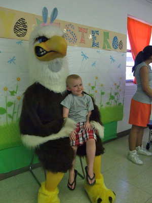 Image: Eagle mascot and Jack Nelson — Jack was not even afraid of the big eagle as he sat in his lap to get his picture taken.