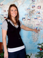 Image: Lora Garrison — Lora Garrison points to map to show where she will be traveling to.