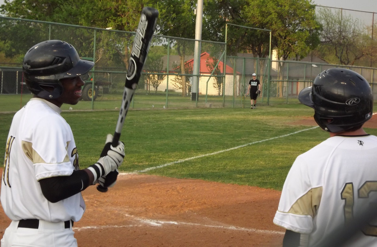 Image: Jasenio discussing the game — Senior Jasenio Anderson discusses the next play with Buck.