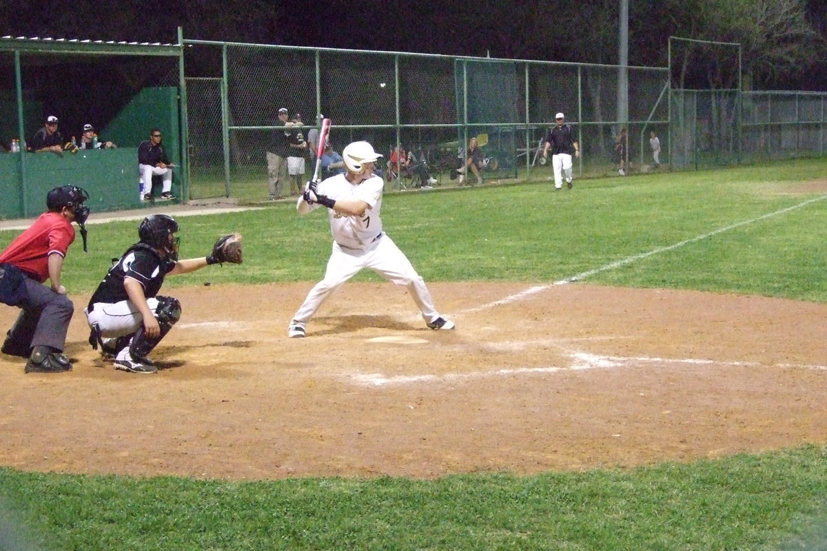 Image: Kyle gets ready — Senior Kyle Wilkins swings away.