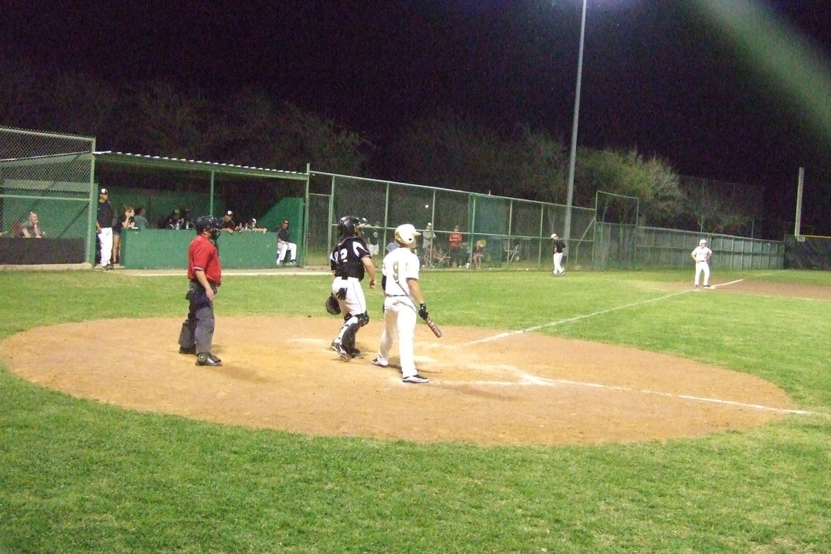 Image: Ethan at bat — Senior Ethan Simon steps out of the box for instruction.