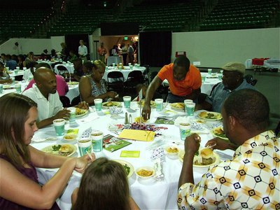 Image: Table full of support — Jasenio Anderson prepares to dine with his family before being announced as an All-Star player in the upcoming 2011 Super Centex FCA Victory Bowl.