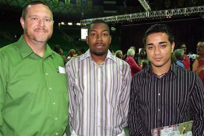 Image: The Bulldogs — Coach Ronnie Crumpton and Milford Bulldog football players, Jamie Johnson and Rolando Vega, get ready to exit the FCA All-Star Victory Banquet and begin helping, Vega, get ready for the 2011 Super Centex FCA Victory Bowl.