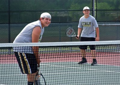 Image: Tennis is fun — JV doubles partners, Kevin Roldan and Zain Byers, are just enjoying the moment.