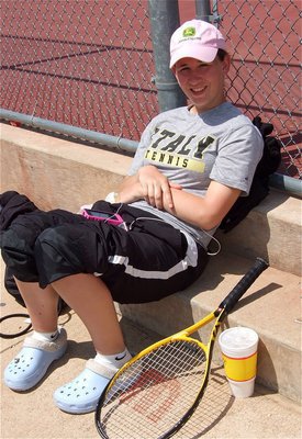 Image: Off the court — Lisa Olschewsky relaxes after her match.