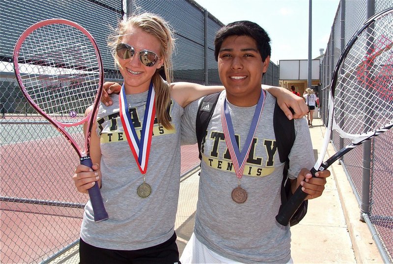 Image: Sierra and Cruz — Sierra Harris and Cruz Enriquez display their tennis medals. Harris won the 15 AA JV Girls Singles District Championship and Enriquez qualified for Regionals as the 15 AA Boys Singles Alternate.