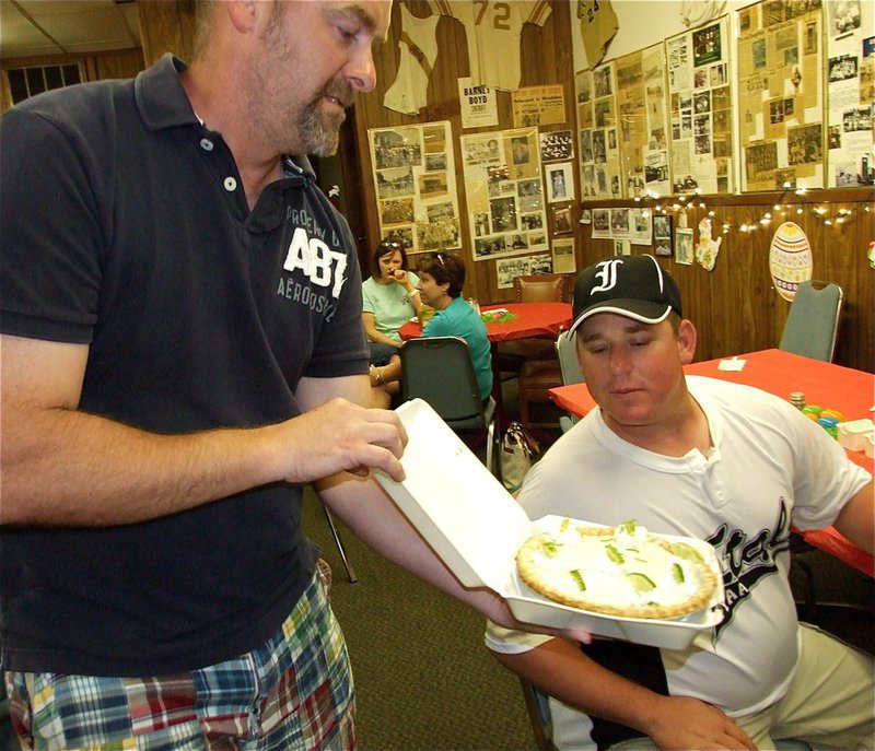 Image: Oh, yeah! — Yum! Scott Connor takes a gander at the key lime pie about to be auctioned by event emcee, Doug Nelson.