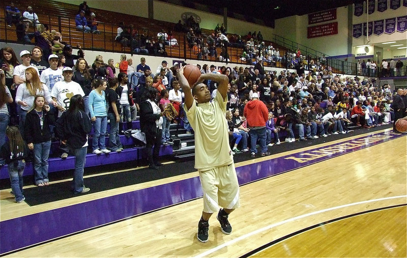 Image: Heath prepares — Senior Heath Clemons(2) practices from behind the arc on the Wisdom Gymnasium floor at Tarleton State University.