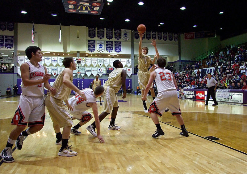 Image: Colton pulls the trigger — Gladiator Colton Campbell(5) shoots a one-handed jumper from inside the lane.