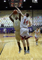 Image: Mayberry underneath — Larry Mayberry (13) draws a shooting foul from Melissa Cardinal Zach Helmberger(14).