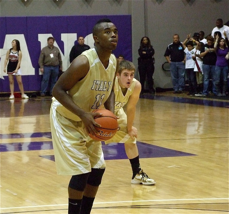 Image: Anderson at the line — Ryan Ashcraft looks on as fellow senior Jasenio Anderson(11) concentrates at the line.