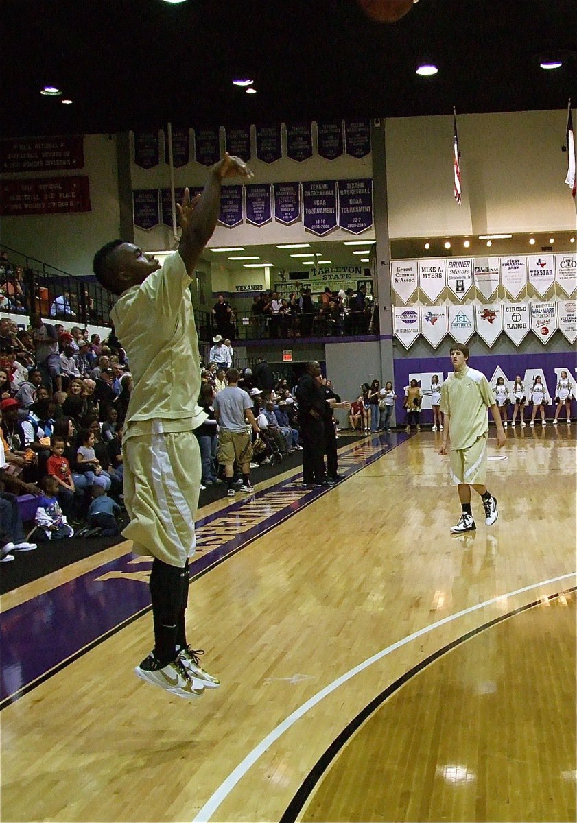 Image: Getting ready — Jasenio Anderson gets warmed up just in time to record four three-pointers in the first quarter and keep the Gladiators in the game.