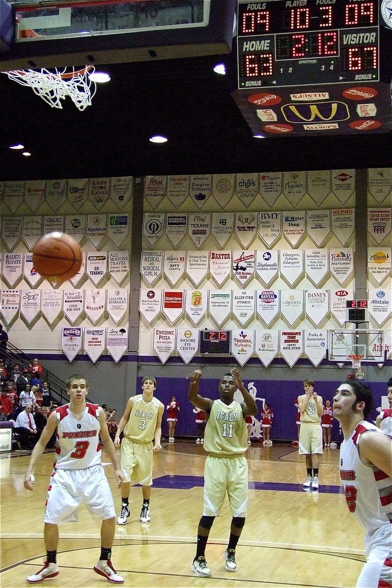 Image: Ice water in his veins — Swishing the free-throw is Jasenio Anderson(11) to help ice the game for Italy.