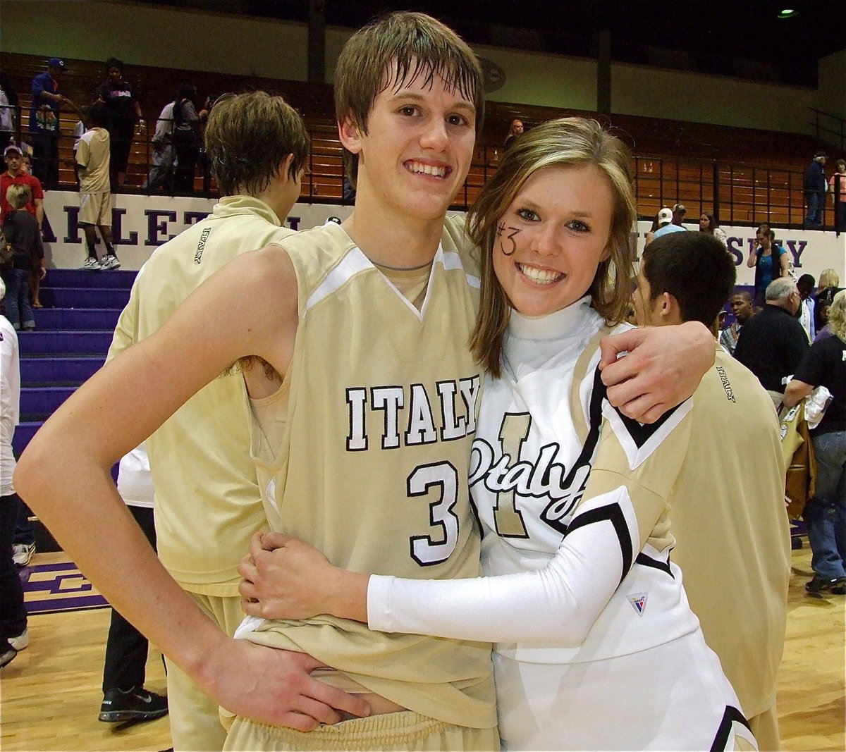 Image: Great game! — Jase Holden gets a congratulatory hug from IHS Cheerleader Kaitlyn Rossa after the Gladiators beat Ponder 74-67 for the regional semifinal championship.