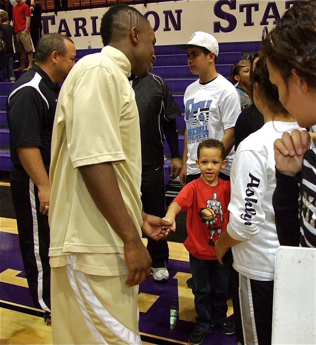 Image: Celeb status — Jasenio Anderson thanks the fans both large and small after the game.