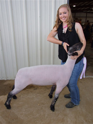 Image: Italy’s Jaclynn Lewis raised the overall Reserve Grand Champion Lamb — The lamborghini of the Ellis County Youth Expo: Jaclynn Lewis won 1st in class, Medium Wool Breed Reserve and overall Reserve Grand Champion of the lamb show.