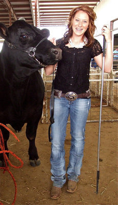 Image: Bailey Bumpus — Bailey Bumpus prepares to enter the sale ring with her Angus steer.