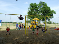 Image: A “Swinging Good Time” — The swings were a great success.