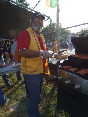 Image: Mark Souder — Lions Club member Mark Souder was busy grilling hot dogs for all.