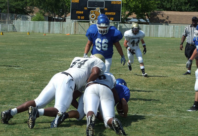 Image: Stuffing the pass — Italy’s Larry Mayberry and Bobby Wilson sack the Blooming Grove quarterback.