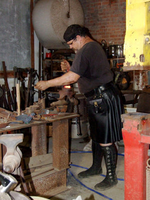Image: Cliff Hard At Work — Cliff is demonstrating bending his metal using heat.