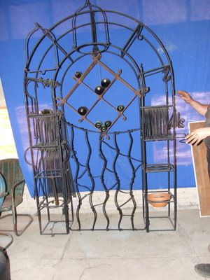 Image: Wine Bottle Arbor — This beautiful arbor can hold wine bottles, pots, wind chimes and whatever you can think of.