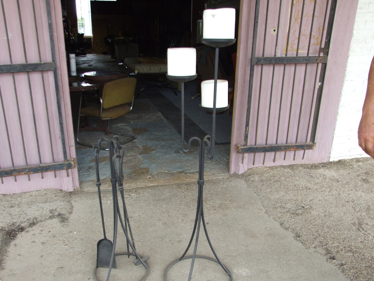 Image: More Beautiful Iron Work — Displayed here is a fireplace tool set and a large candle stand.