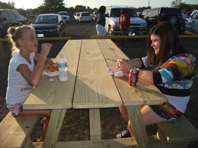 Image: Hannah and Bailey — Hannah Washington and Bailey DeBorde enjoy the new picnic tables built by Donald Chambers.