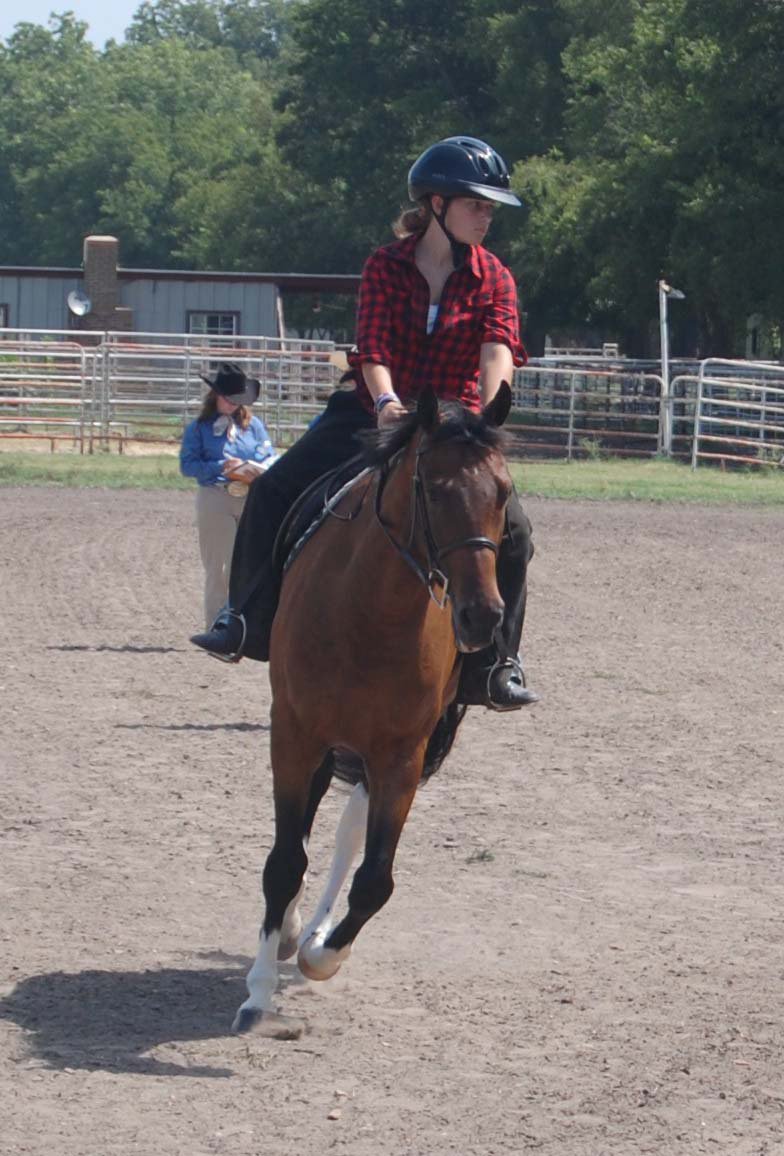 Image: Elizabeth Terry and Leap At Daylight — Elizabeth Terry of Waxahachie rides Leap At Daylight in equitation over ground poles at the ECEYA Fundraiser Show.