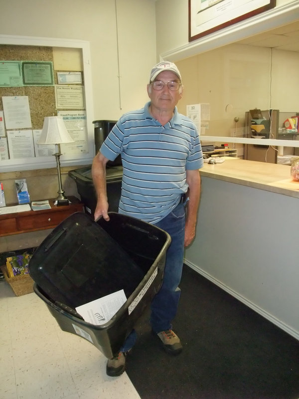 Image: Ready to recycle — Mr. Roger Jackson stopped by the City Hall in downtown Italy to grab his Free Recycle bin on Wednesday.