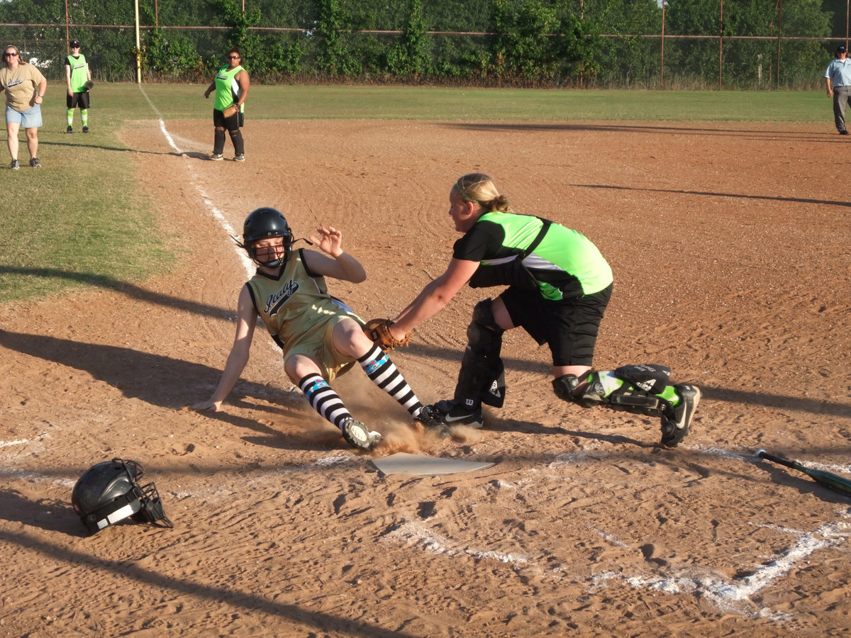 Image: Safe! — You make the call! However, Italy scored on this slide at the plate.